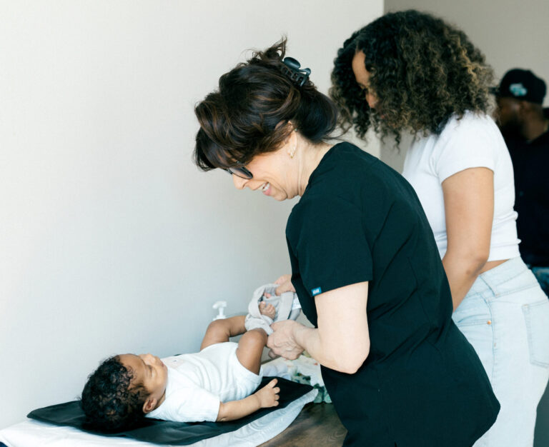Postpartum Doula Changing Diaper