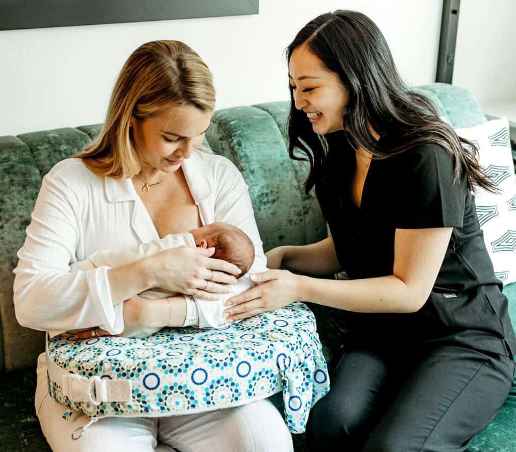 IBCLC helping to support new mother with breastfeeding